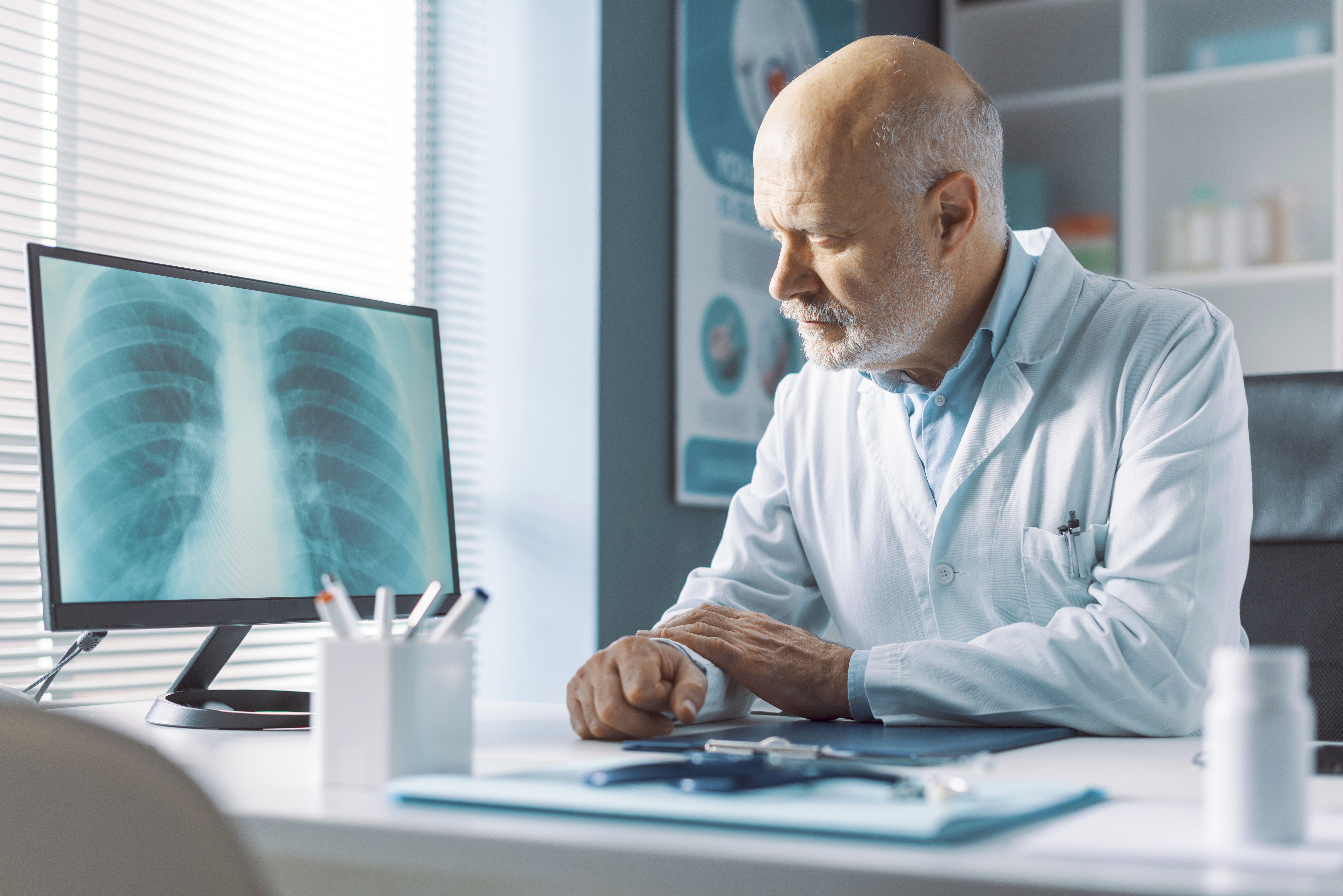 GettyImages-1316192297-Doctor_Looking_at_Xray-RET-1