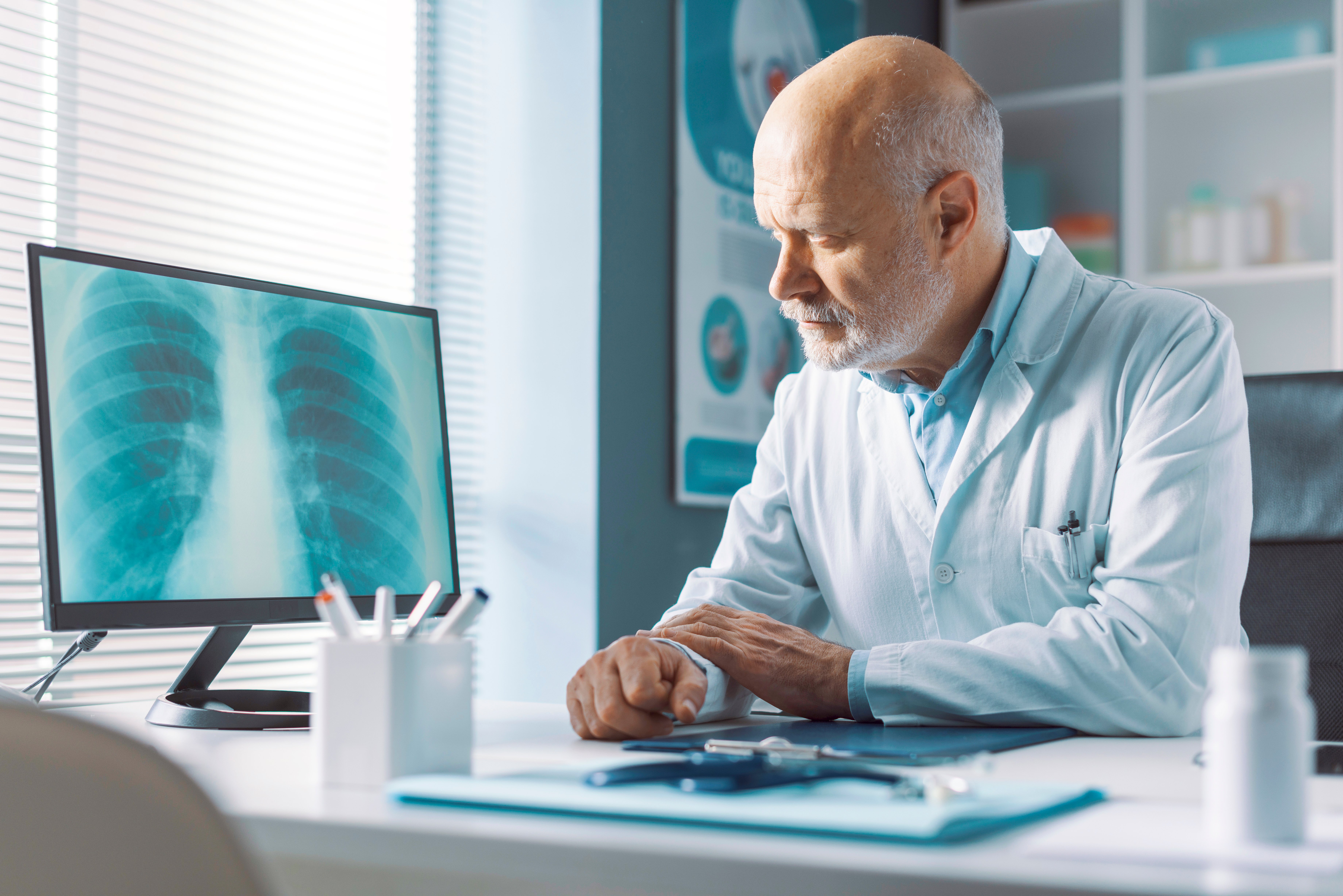 GettyImages-1316192297-Doctor_Looking_at_Xray-RET-3