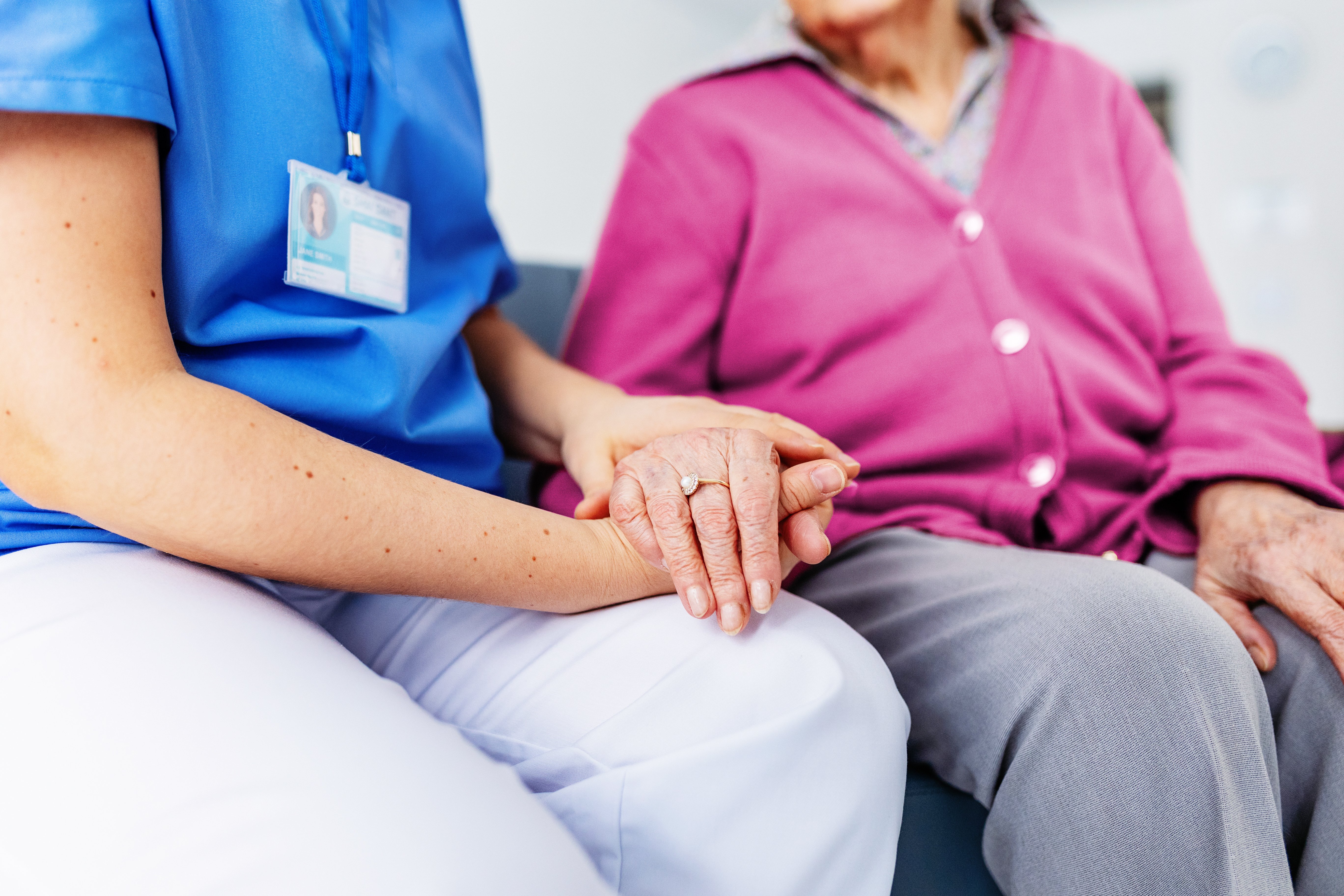 GettyImages-2027654752-Doctor_Patient_Holding_Hands-RET