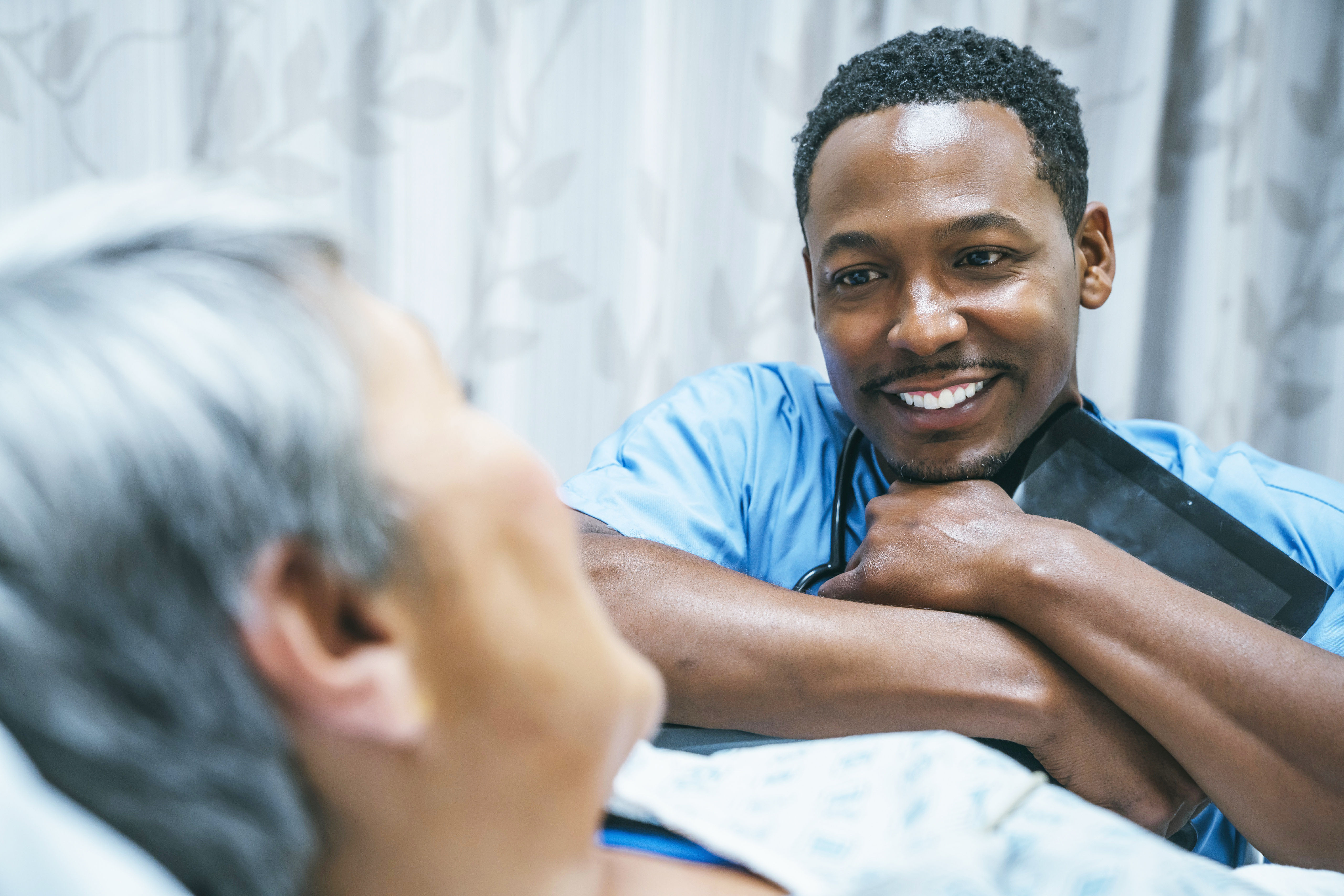 GettyImages-906006644-Doctor_Talking-to_Patient-RET-1