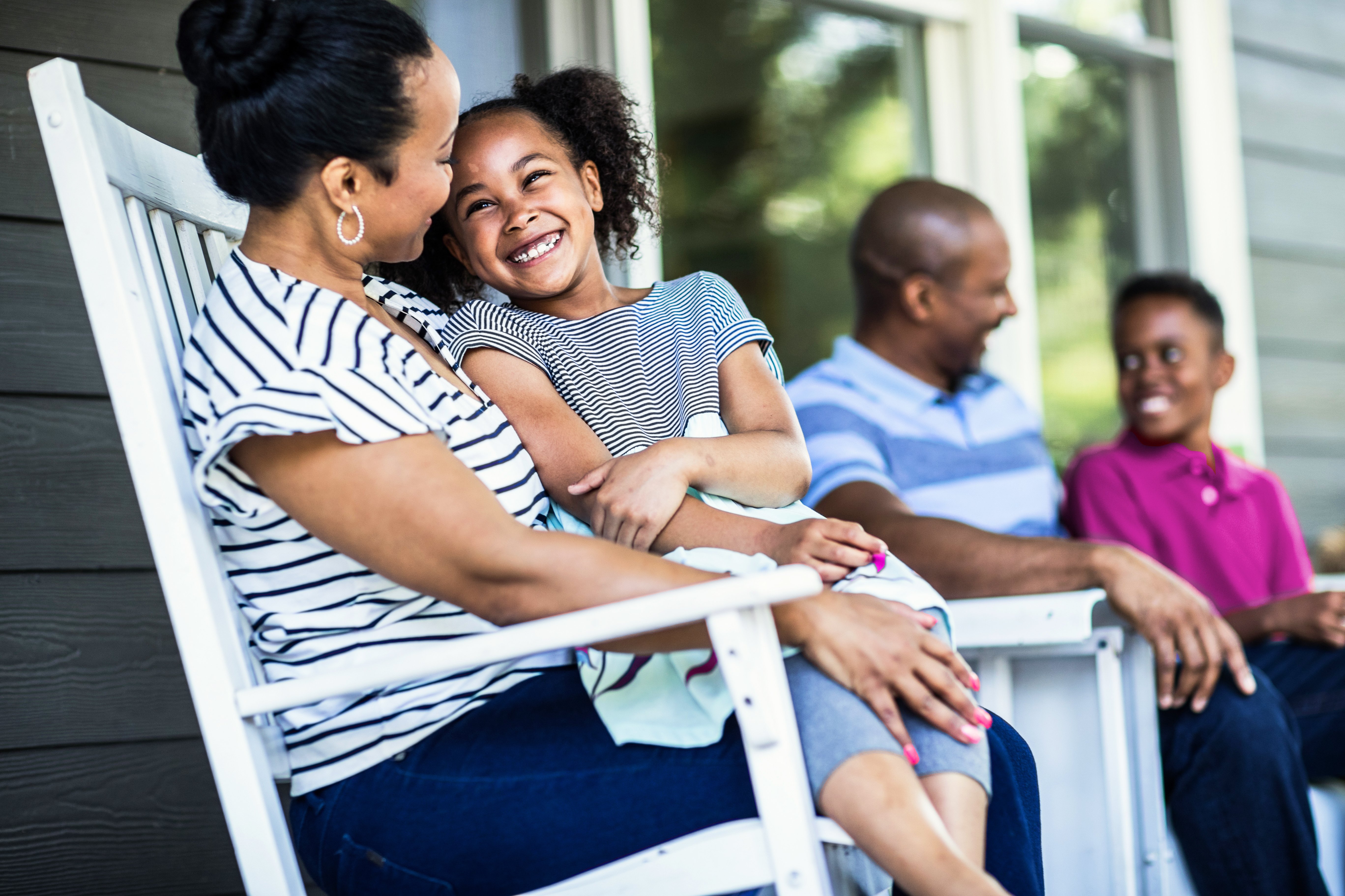 GettyImages-959200134-Family_on_Porch-RET